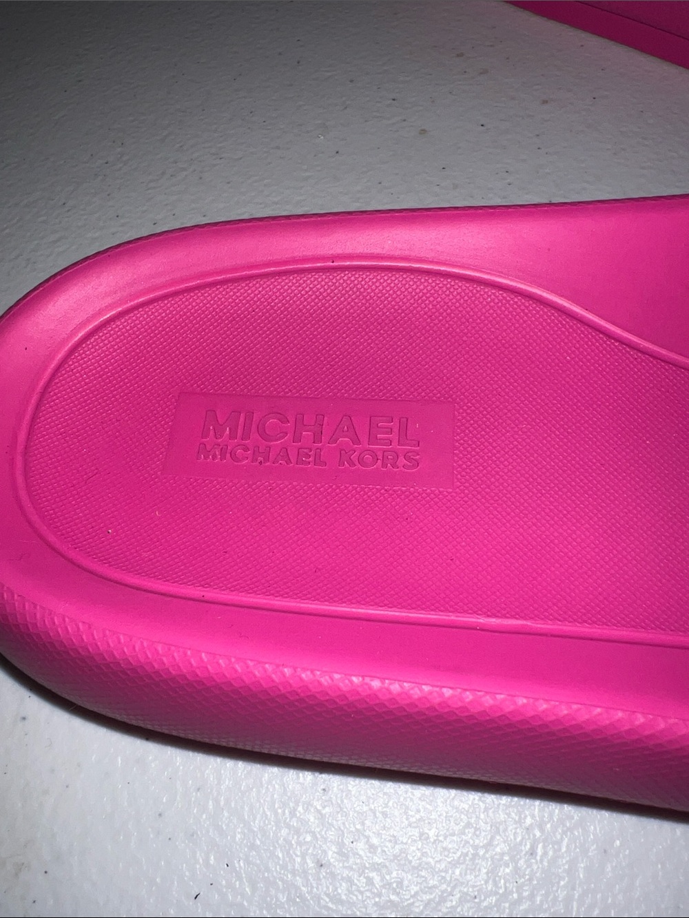 Michael Kors Splash Slide sandals in a bright cerise pink color. - Picture 2 of 6